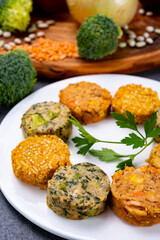 Small tasty vegan and vegetarian burgers made from fresh vegetables and dried legumes and beans