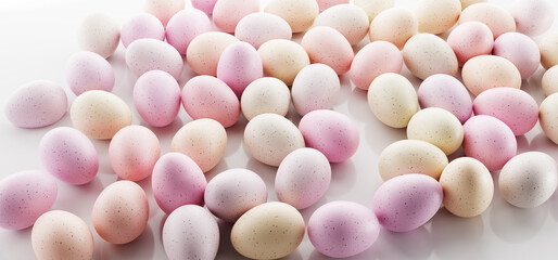 Easter eggs painted in pastel colors background