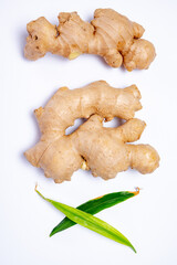 Fresh ginger rhizome root used in traditional medicines and for flavoring meals isolated on white