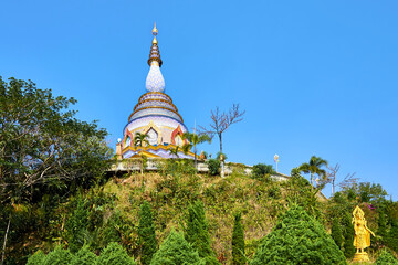 Naklejka premium Spectacular Crystal Pagoda (Chedi Kaew) of Wat Tha Ton (Phra Aram Luang) is a famous Buddhist complex in the north of Thailand. Mae Ai district, Chiang Mai province