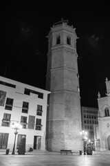 Obraz premium Castellón de la Plana, Valencian Community, Spain (Costa del Azahar). El Fadrí tower on the square Mayor (plaza Mayor). Black and white photography (monochrome). Shot by night.