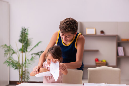 Schoolboy and his small sister staying at home during pandemic