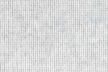 White natural texture of knitted wool textile material background. White crochet cotton fabric woven canvas texture. close up
