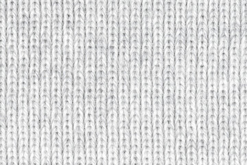 White natural texture of knitted wool textile material background. White crochet cotton fabric woven canvas texture. close up