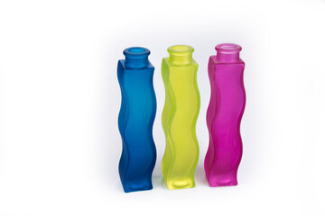 Three colorful glass vases on a white background