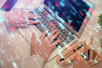 Double exposure of woman hands working on computer and data theme hologram drawing. Tech concept.