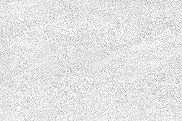 White natural texture of knitted wool textile material background. White crochet cotton fabric woven canvas texture. close up