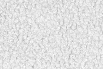 White natural texture of knitted wool textile material background. White crochet cotton fabric woven canvas texture. close up