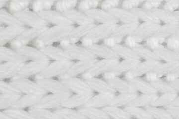 White natural texture of knitted wool textile material background. White crochet cotton fabric woven canvas texture. close up