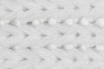 White natural texture of knitted wool textile material background. White crochet cotton fabric woven canvas texture. close up