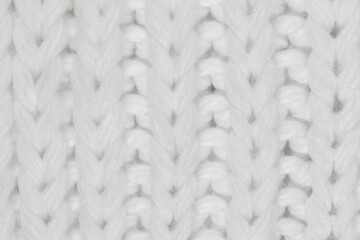 White natural texture of knitted wool textile material background. White crochet cotton fabric woven canvas texture. close up