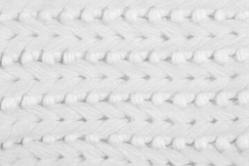 White natural texture of knitted wool textile material background. White crochet cotton fabric woven canvas texture. close up