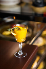 Yellow coctail shot in the bar