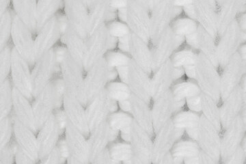 White natural texture of knitted wool textile material background. White crochet cotton fabric woven canvas texture. close up