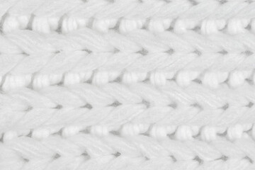 White natural texture of knitted wool textile material background. White crochet cotton fabric woven canvas texture. close up