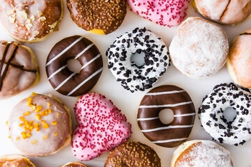 Donuts with colorful icing on a white background.