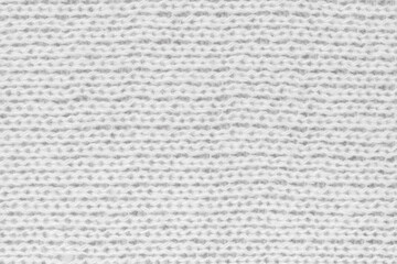 White natural texture of knitted wool textile material background. White crochet cotton fabric woven canvas texture. close up