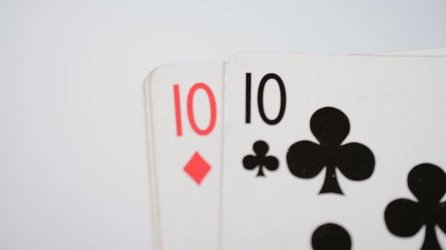 Playing cards four tens on a white background close