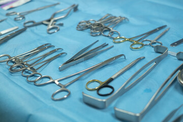 Fototapeta premium Surgical equipment and medical devices in operating room. Sterile scissors and other medical instruments