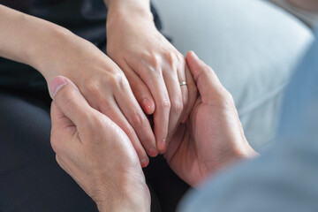 Asian couple holding hands