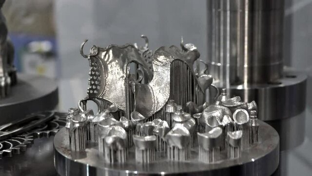 3D model of human teeth printed on metal 3d printer close-up. Technology selective laser melting, sintering metal. New prototyping additive technology. Medical stomatological dental crowns bridge