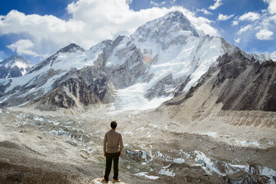Rear view of man looking at Mt. Everest during winter