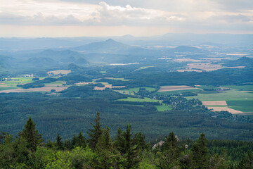 Beautiful sunrise in Czech mountains with fog