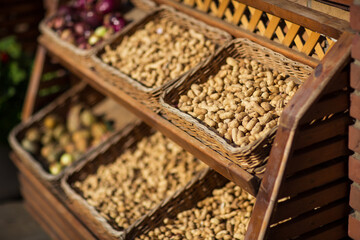 dried fruits in baskets on the showcase