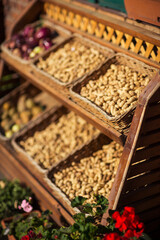 dried fruits in baskets on the showcase
