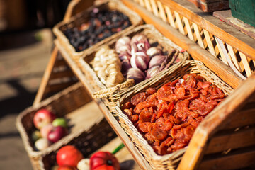 dried fruits in baskets on the showcase