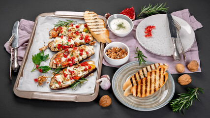 Fresh baked eggplants with walnuts and pomegranate. Delicious summer snack