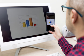 Businessman Using Technology To Analyze Results Of The Production