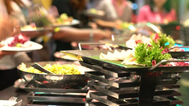 Buffet dinner catering in hotel party with prople hand grab food,  Food and drink all you can eat Concept
