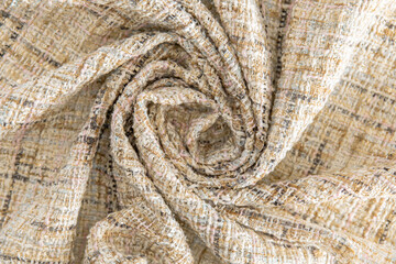 Fototapeta premium light yellow dense fabric with a spiral drapery