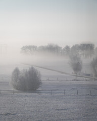 Cold snowy rural winter landscape scene in Skåne Sweden