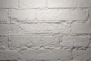 A rough white Brick Wall and light