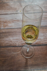 Glass of champagne isolated on wooden background