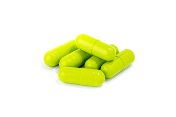 Green medicine capsules isolated on white background
