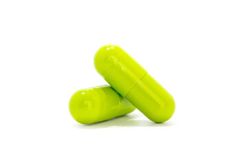 Green medicine capsules isolated on white background