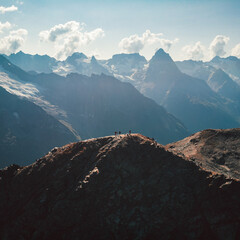 Caucasus, Dombay, a view from a drone in sunny weather on the peak of Moussa-Achitara and the people on top