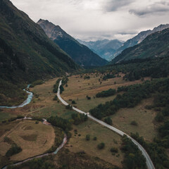 Caucasus, Dombay, a bird's-eye view of the Gonachkhir gorge, the mountain river and the military-Sukhum road in cloudy weather