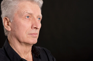 Obraz premium portrait of sad senior man in studio