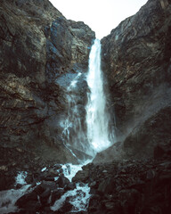 Russia, the Caucasus, Dombay, Big Sofrudjuksky (Sofrudjinsky) waterfall, powerful and high in the evening light, the dramatic landscape
