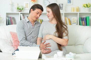 happy pregnant woman with husband