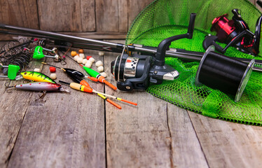 accessories for fishing on a wooden background. selective focus.