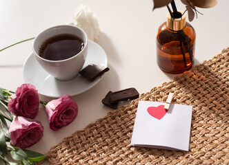 Magic mood atmosphere of love picture for post in Instagram. Take break, rest with tea and chocolate. With love and care and flowers around. Business idea of psychology and aroma. Layout.