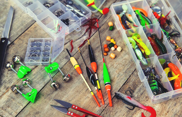 accessories for fishing on a wooden background. selective focus.