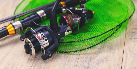 accessories for fishing on a wooden background. selective focus.