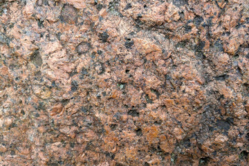 The texture of a large bright stone close-up.