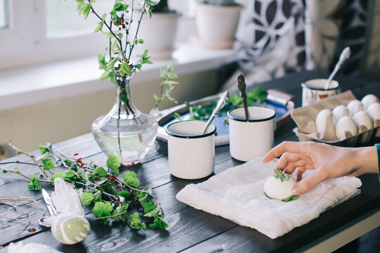 Painting white eggs for Easter